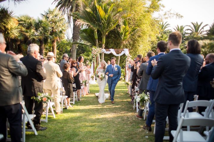 wedding couple walks down aisle