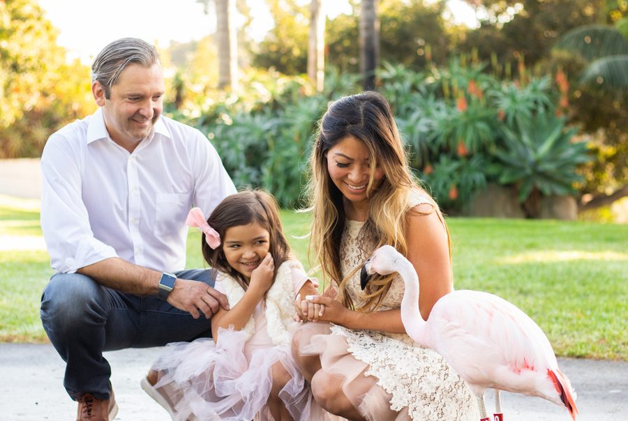 family beside a flamingo